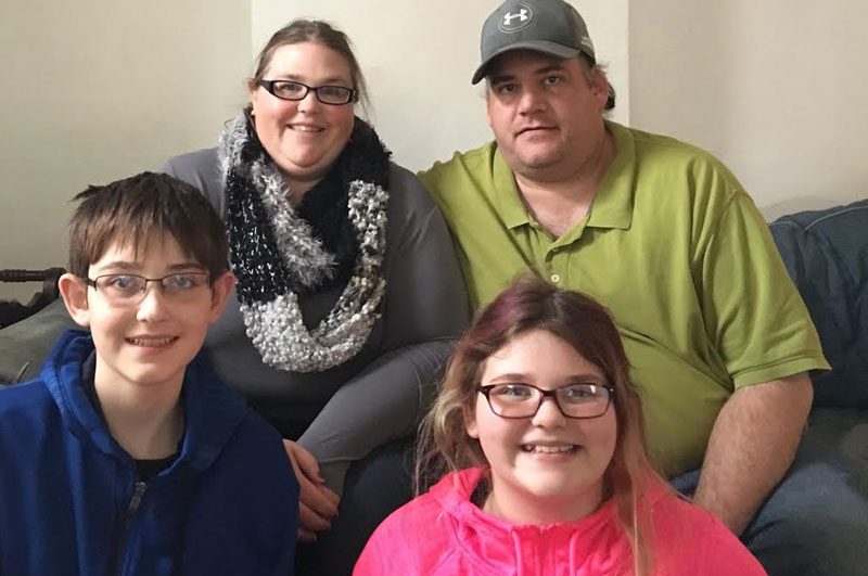 Chris Burrier (left), with his parents Becky and Mike, and sister, Sydney (front, right), continue to battle the system.