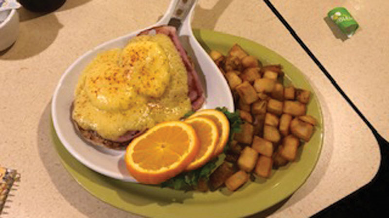 A classic blend of smoky sliced ham, soft poached eggs, English muffins, and a creamy Hollandaise sauce.