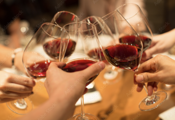 Group toasting wine glasses