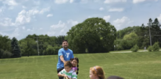 People play tug of war.