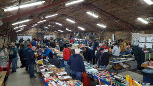 People walk at the train show