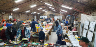 People purchasing model trains at the gift shop.